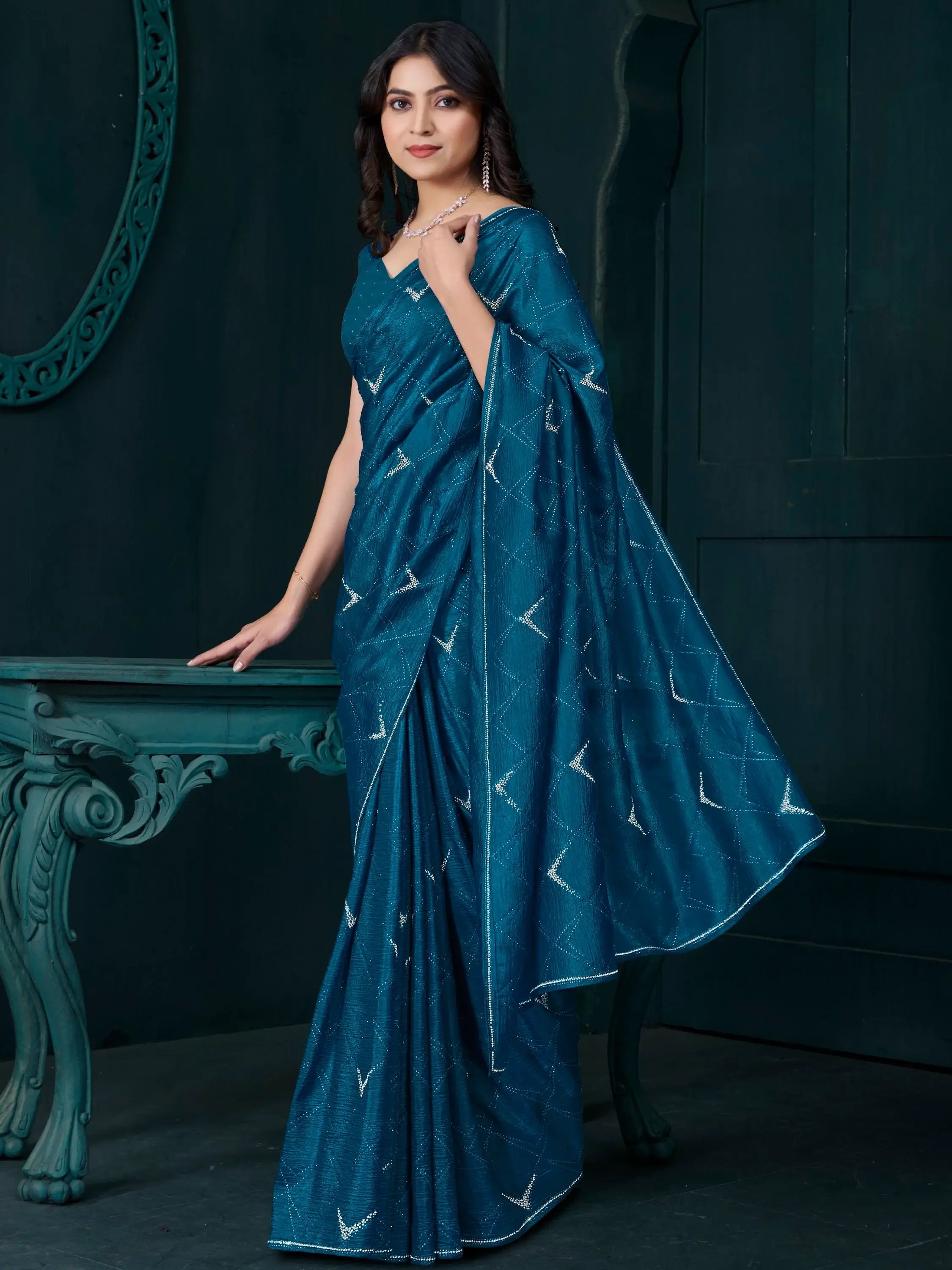 Fascinating Teal Blue Crepe Silk Party Wear Saree With Blouse